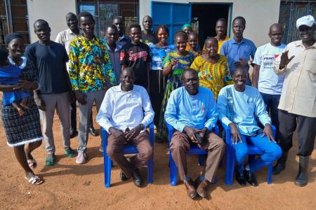 Pastors pose for a photo after the theological training