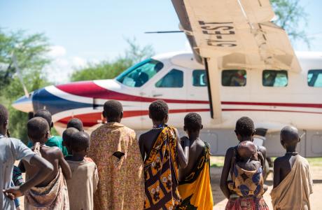 People looking at a MAF aircraft in South Sudan