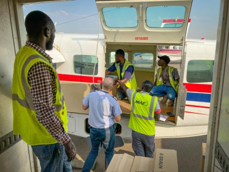 Loading medical supplies onto a MAF aircraft