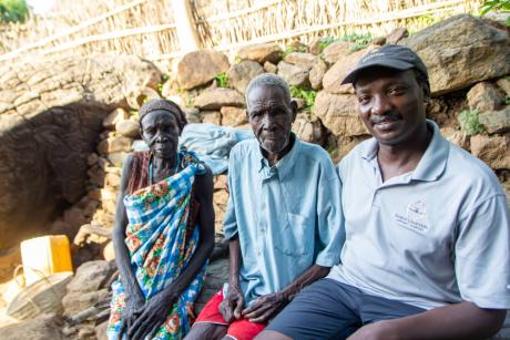 Missionary Robert Bett with neighbours in Loit